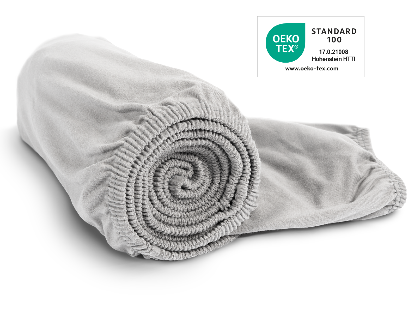 Das BODYGUARD® Jersey-Spannbettlaken in Silber zusammengerollt. Das Oeko-Tex® Standard 100 Siegel