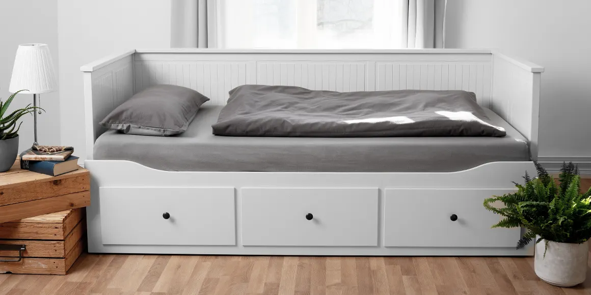 Photo: A sofa bed with drawers, covered with BODYGGUARD bed linen 135x200 cm and sheets.