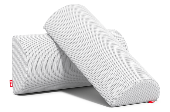Two knee and neck rolls lie diagonally on top of each other.	
