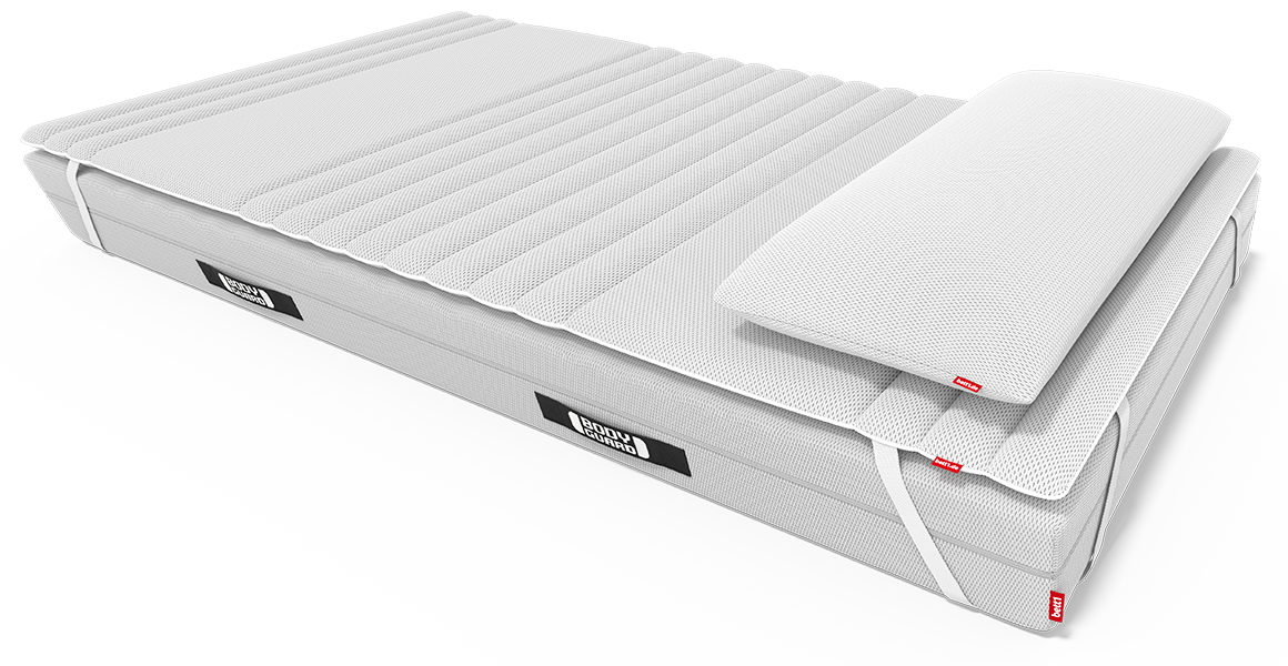 The 90x200 cm topper is attached to the 90x200 cm BODYGUARD mattress with the fastening straps, and the BODYGUARD visco pillow lies on top.
