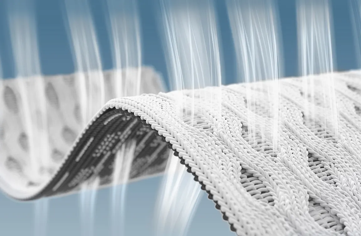 Grafik: Ein Luftstrahl strömt durch die drei Stoffschichten des HyBreeze Funktionsbezug