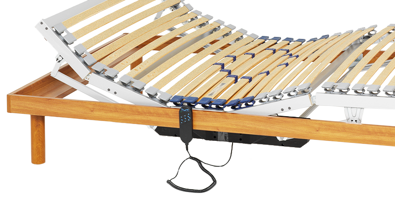 An electrically adjustable slatted frame 90x190 with cable and remote control inside a simple wooden bed frame. The head and foot sections are raised.