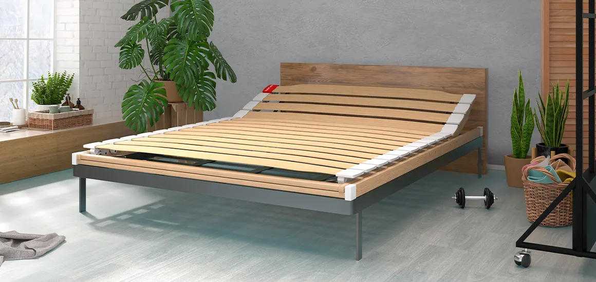 Photo: A wooden bed without a mattress in a bedroom, revealing the full-length 140x200 cm slatted frame.
