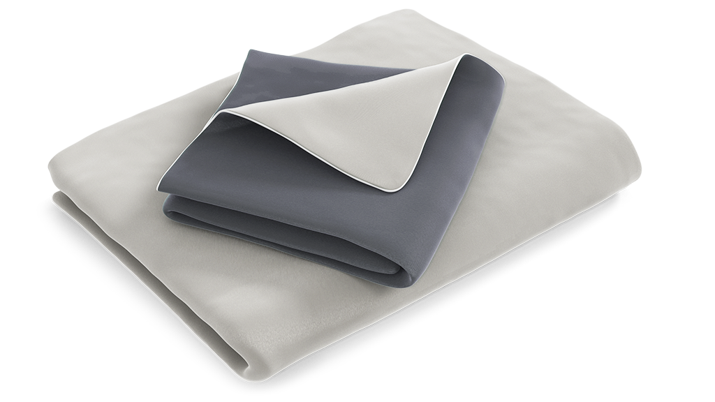 The folded satin bed linen: the duvet cover is folded with the silver side facing outwards, the pillowcase with the anthracite-coloured side