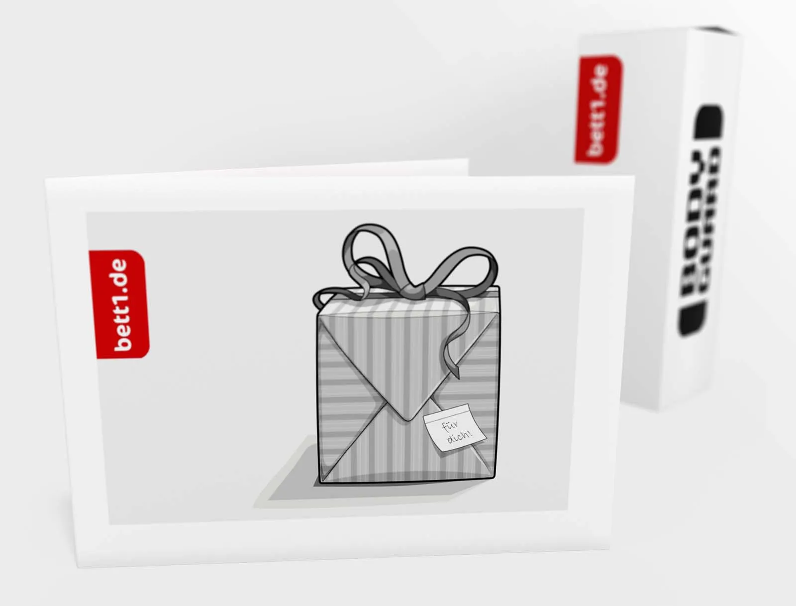 Der bett1.de Geschenk-Gutschein steht vor einem Matratzenkarton – Motiv für jeden Anlass: Ein Geschenk mit Schleife.