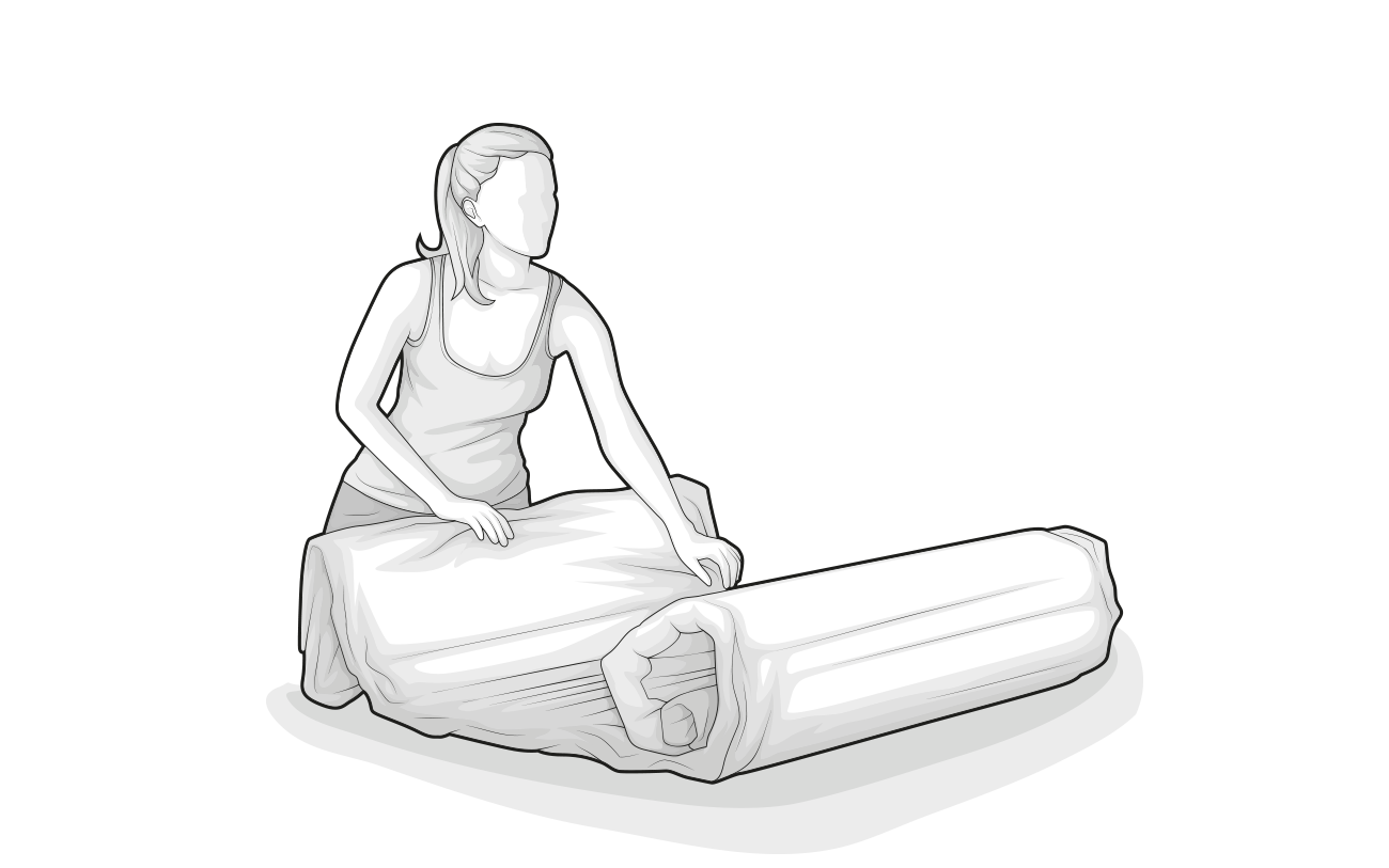 Illustration: A person unrolls a compressed mattress
