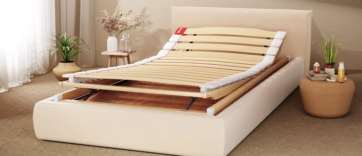 The BODYGUARD Slatted Frame (100x200 cm) with raised head and foot sections is placed on a box spring bed in a brightly furnished bedroom.