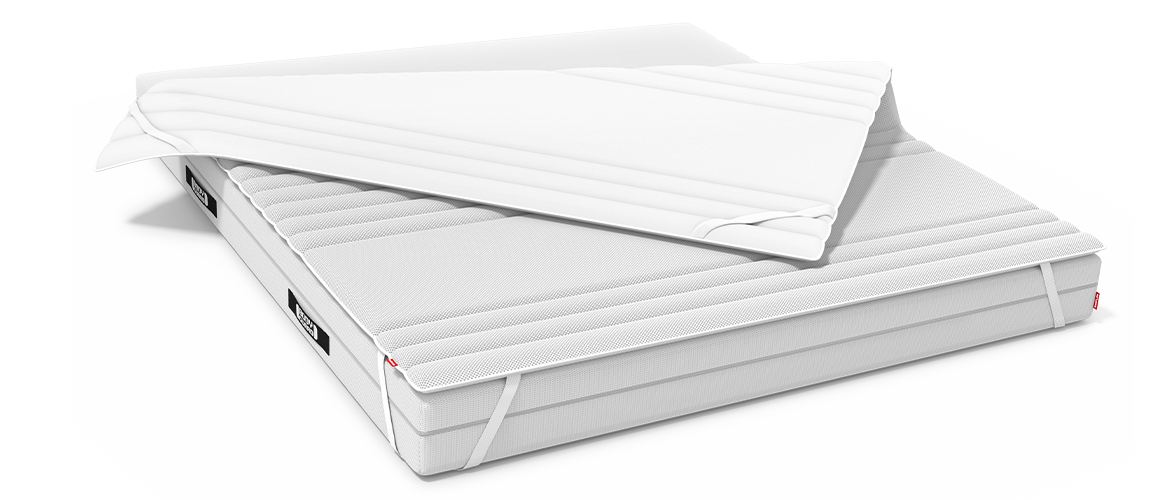 A BODYGUARD® Mattress half-covered with the BODYGUARD® Topper. One half of the topper is folded down to reveal the second side of the cover. 
