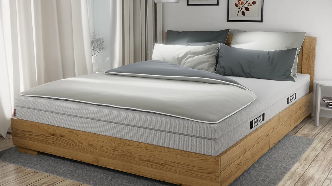 Photo: A large double bed is covered with a large double duvet in 200x200 cm bed linen.