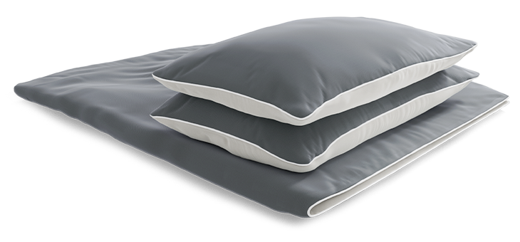 Two pillows lie neatly on top of each other on a folded duvet. The bedding is covered with summer bedding measuring 200x220.