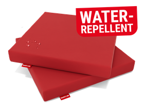 Two RAINGUARD Seat Cushions lying on top of each other. Water droplets beading on the top surface. Text: Water-repellent
