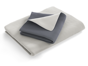 The folded SOFT BREEZE® Satin Bed Linen: the duvet cover is folded with the silver side facing outwards, the pillowcase with the anthracite-coloured side	