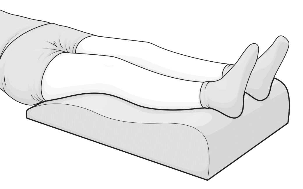 Legs raised on the Leg Elevation Pillow.	