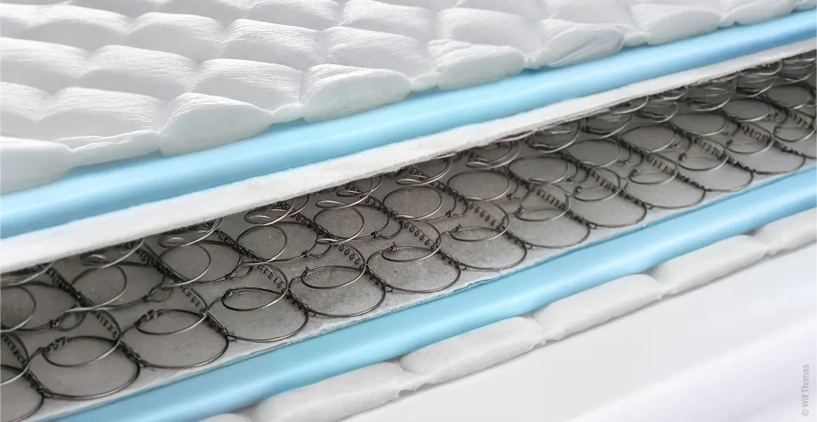 A Bonell innerspring mattress with an open core so that the individual layers are visible.