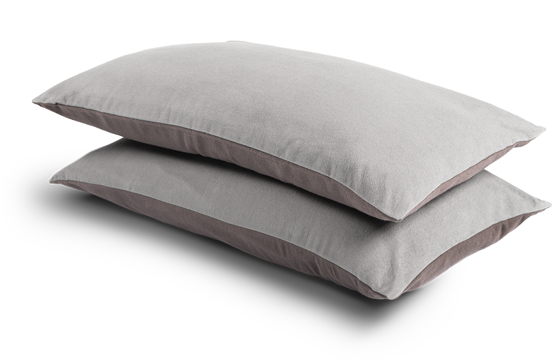 Two narrow cushions 80x40cm, covered with the Flannel Bed Linen. The dark, anthracite-coloured side of the front one is visible, the light, silver side of the back one.