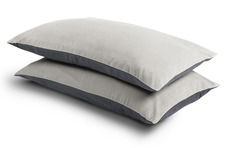 Two narrow cushions 80x40cm, covered with the Flannel Bed Linen. The dark, anthracite-coloured side of the front one is visible, the light, silver side of the back one.