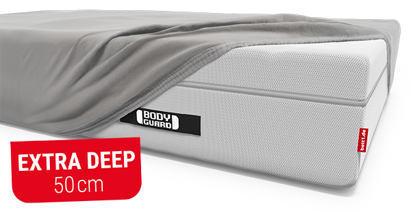 The BODYGUARD box spring mattress fitted with the BODYGUARD fitted sheet extra deep. Text: extra deep 50 cm.