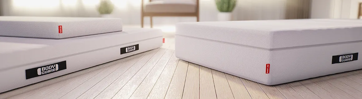Illustration: The BODYGUARD® Mattress in the sizes 80x190 cm, 90x200 cm, 140x220 cm, 160x210 cm and 200x200 cm. Left a figure with the size indication: 153 cm. Right a figure with the size specification 171 cm and a figure with the specification 180 cm.	