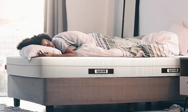 A person sleeping peacefully on a BODYGUARD Mattress