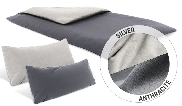 A duvet and two narrow pillows with BODYGUARD Flannel Bed Linen. A circular inset shows the two colours of the reversible covers: silver and anthracite.