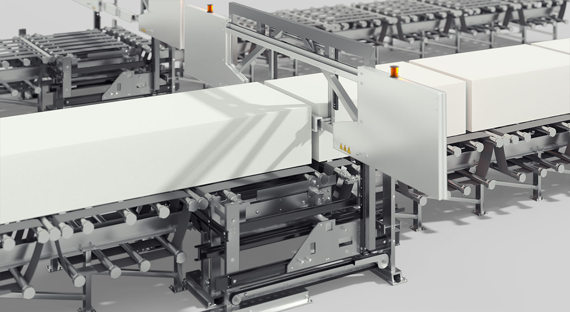 A conveyor belt with a long block of QXSchaum. A cutting device in the centre.