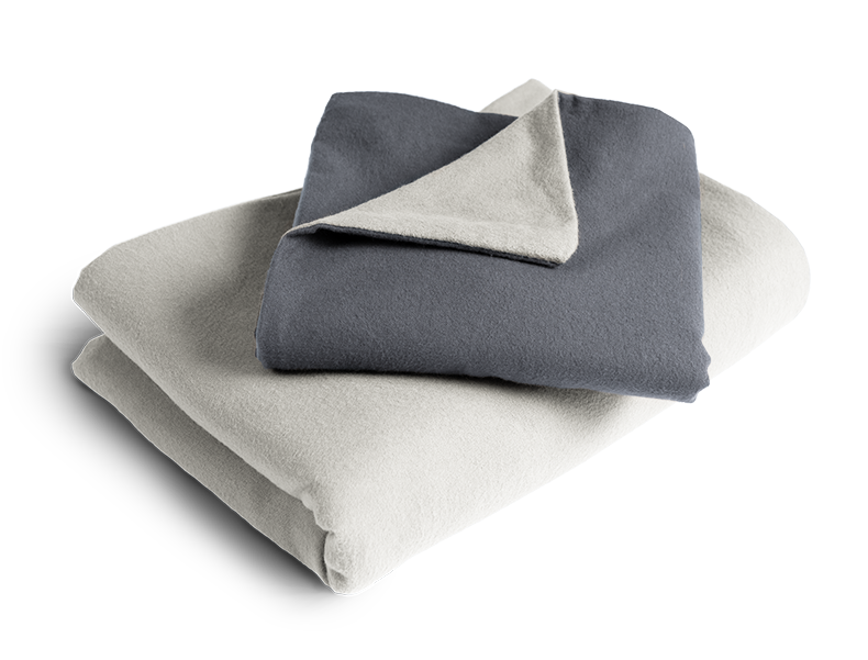 The folded BODYGUARD® Flannel Bed Linen: the duvet cover is folded with the silver side facing outwards, the pillowcase with the anthracite-coloured side	