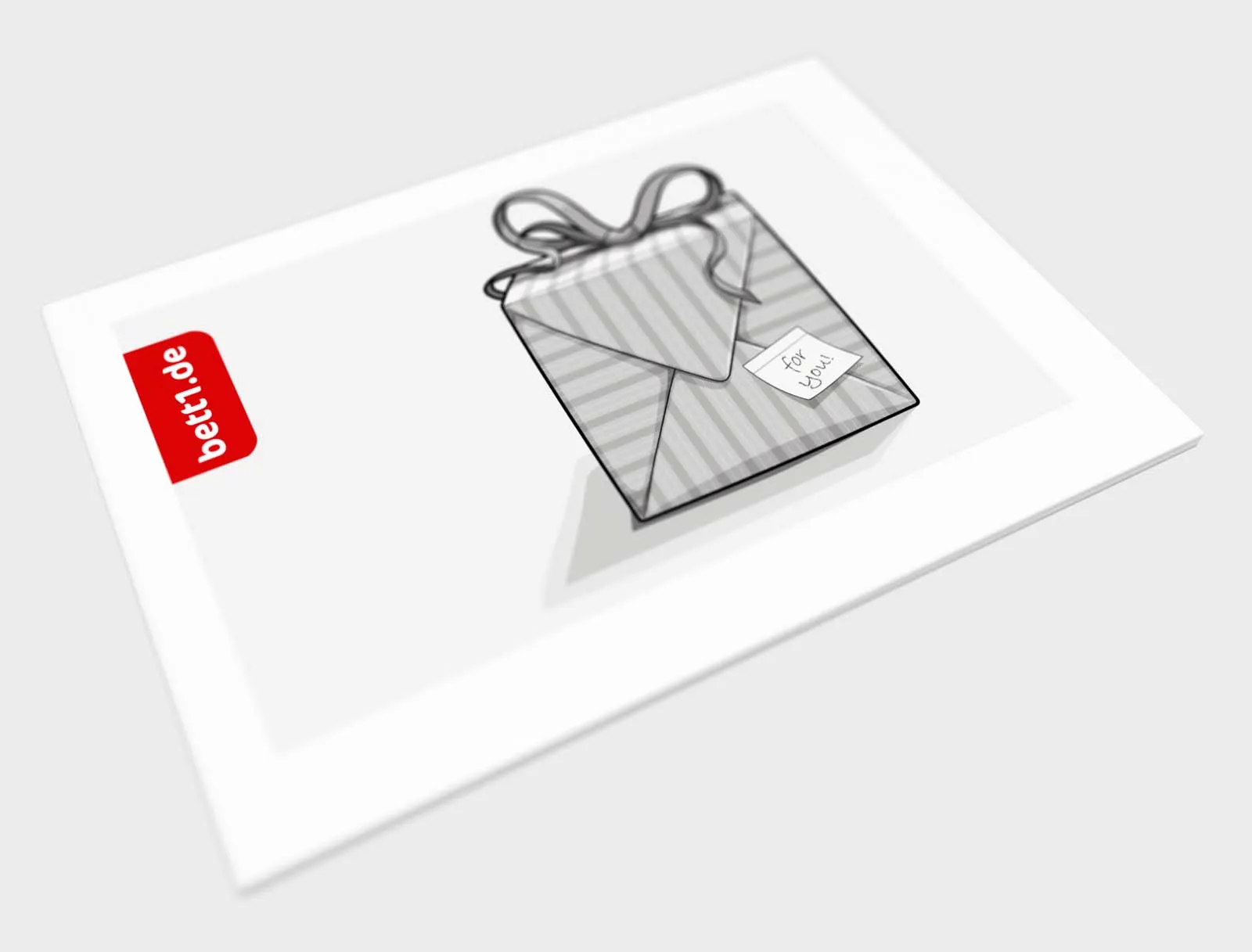 The bett1 gift voucher from the side. Motif: Gift with bow and the note: For you.