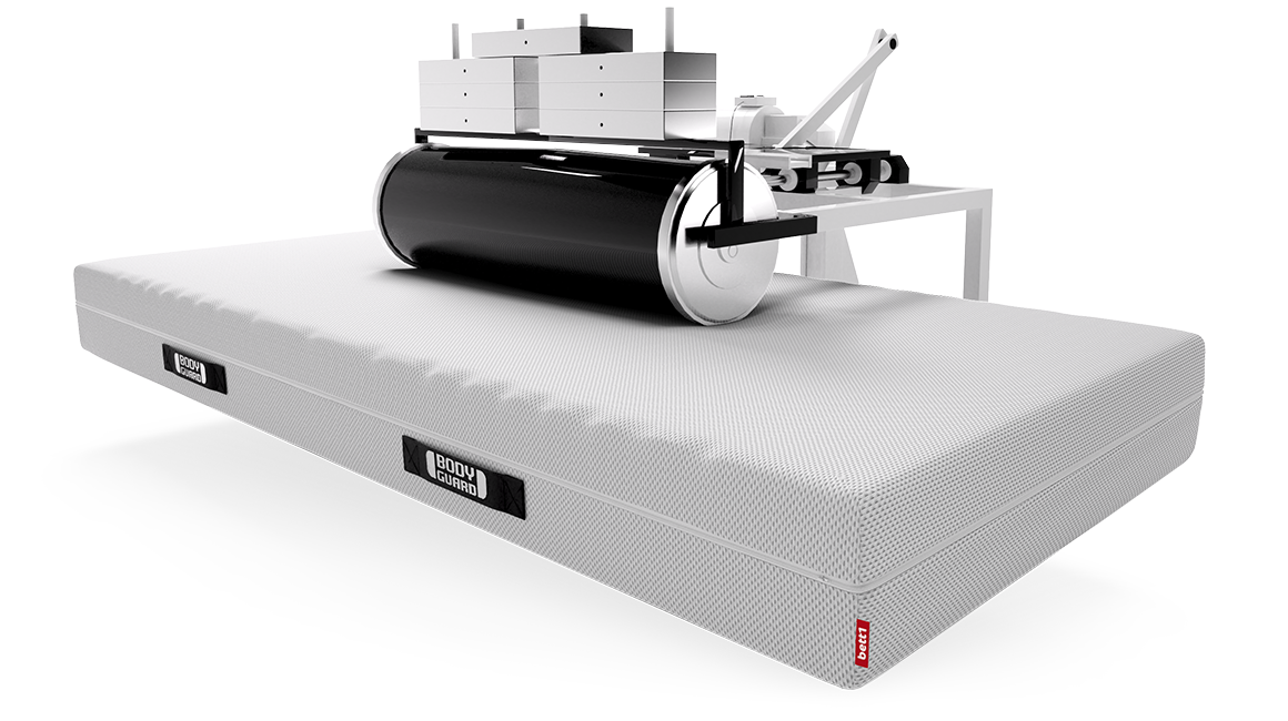 A BODYGUARD mattress is weighed down by a large roller attached to a frame