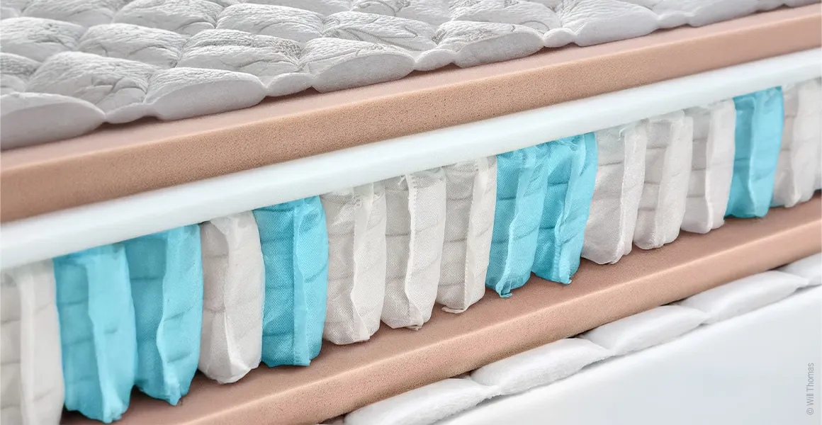 A pocket innerspring mattress with an open core so that the individual layers are visible.