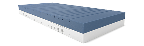 The two-tone core of the BODYGUARD Anti-Kartell-Matratze. The upper side is dark, while the lower side is lighter. The ergonomic modules are clearly visible as cuts and recesses in the cold foam