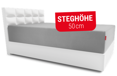 Das BODYGUARD® Spannbettlaken extra hoch aufgezogen auf der BODYGUARD® Boxspring Matratze. Text: Steghöhe 50cm	