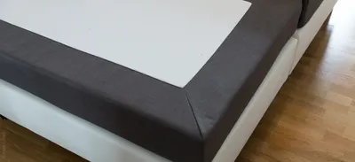 Photo: Corner of a box spring bed frame without a mattress