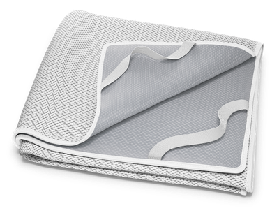 The folded BODYGUARD® Incontinence Pad: a folded-up corner shows the coated underside and the fastening loops.