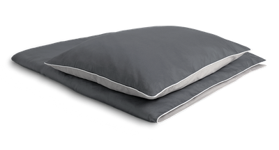 The SOFT BREEZE® Satin Bed Linen covered on a folded duvet with a pillow on it.