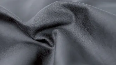 Photo: Close-up view of the smooth structure of a fitted sheet for summer.