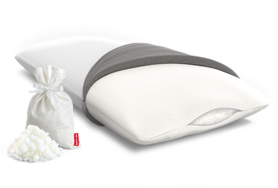 The BODYGUARD Memory Foam Pillow with open cover and view inside the pillow, a small bag and a pile of foam flakes