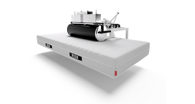 A frame with a large roller is attached to a BODYGUARD mattress.