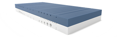 The two-tone core of the BODYGUARD Anti-Kartell-Matratze. The upper side is dark, while the lower side is lighter. The ergonomic modules are clearly visible as cuts and recesses in the cold foam